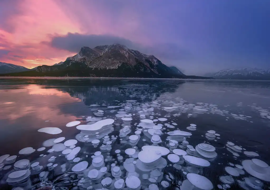 20 Mind-Blowing Places on Earth That Don't Feel Real 10 Frozen Methane Bubbles in Abraham Lake Canada
